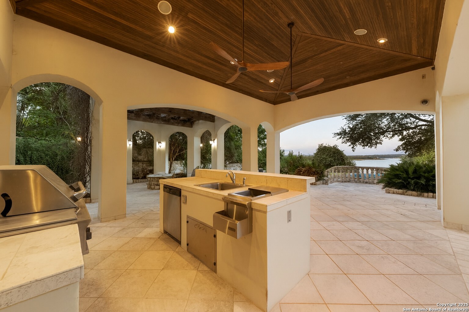 217 Bella Riva Drive Austin, TX 78734 - Photo 34 of 38 a view of a kitchen with stainless steel appliances granite countertop a sink and a refrigerator