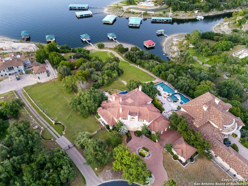 217 Bella Riva Drive Austin, TX 78734 - Photo 38 of 38 an aerial view of a house with a yard