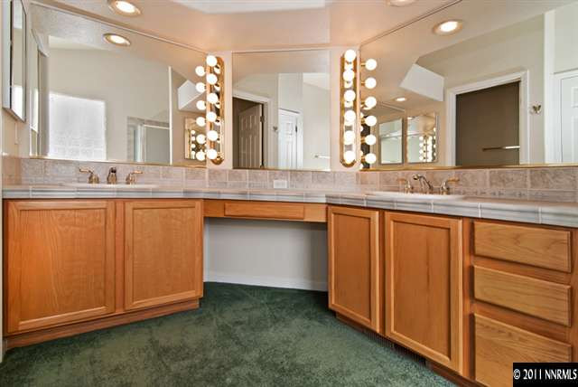 1462 Amston Road Reno, NV 89511 - Photo 11 of 13 a bathroom with a sink and a mirror