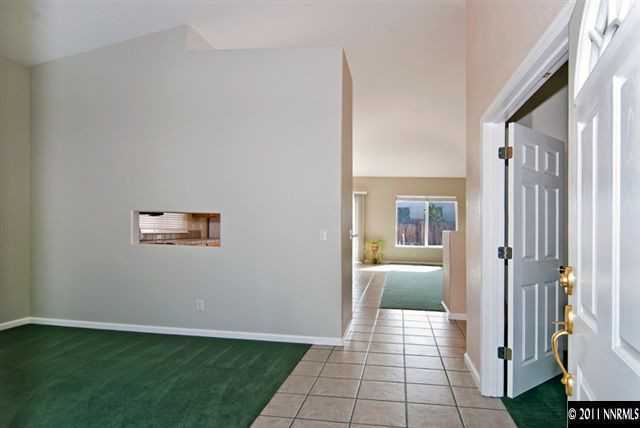 1462 Amston Road Reno, NV 89511 - Photo 4 of 13 a view of a hallway with a livingroom and furniture