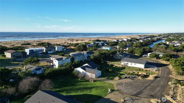 an aerial view of city and lake