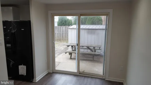 a bathroom with a glass door and a window