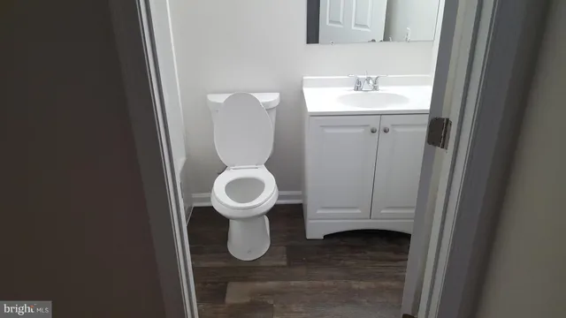 a view of a bathroom with a sink and a mirror