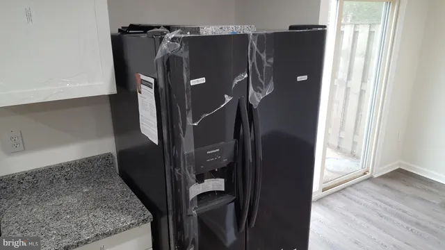 a water heater on the side of a glass door