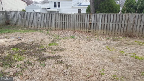 a view of outdoor space with wooden fence