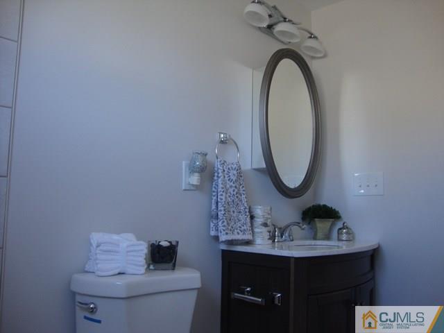 90 Westminster Road Colonia, NJ 07067 - Photo 14 of 25 a bathroom with a sink and a mirror