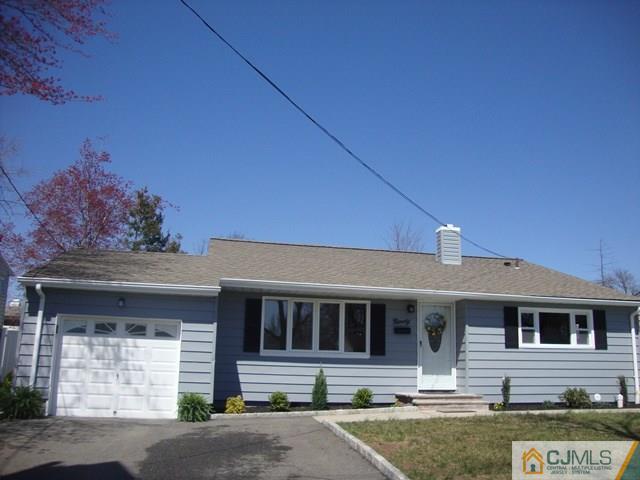 90 Westminster Road Colonia, NJ 07067 - Photo 3 of 25 a front view of a house with garden