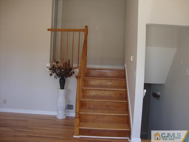 90 Westminster Road Colonia, NJ 07067 - Photo 5 of 25 a view of entryway with wooden floor