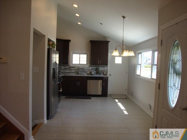 90 Westminster Road Colonia, NJ 07067 - Photo 6 of 25 a bathroom with a sink and a large mirror
