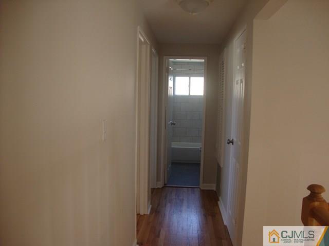 90 Westminster Road Colonia, NJ 07067 - Photo 10 of 25 a view of a bathroom from a hallway