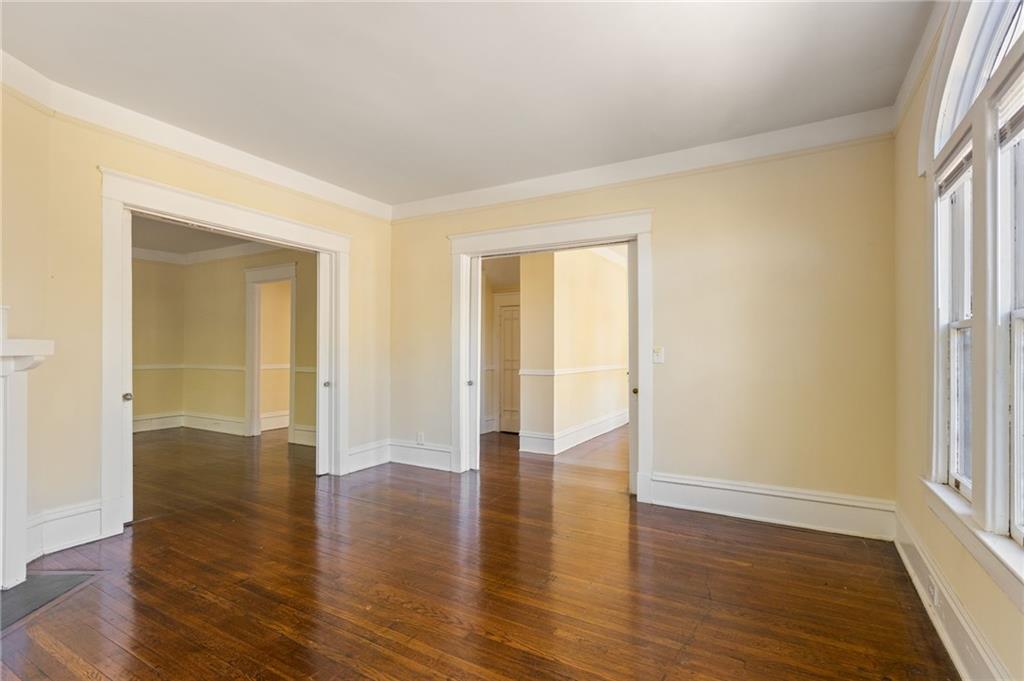120 South Candler Street Decatur, GA 30030 - Photo 35 of 40 an empty room with wooden floor and windows
