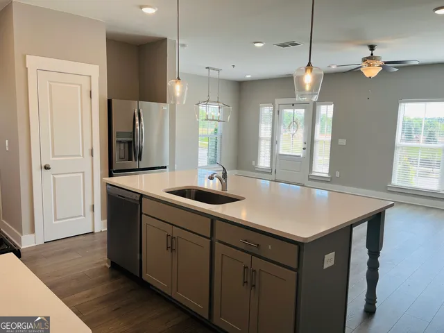 a bathroom with a sink a vanity and a mirror