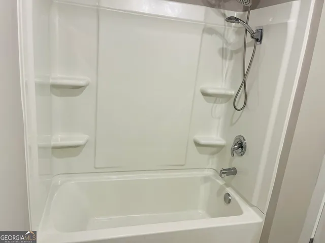 a bathroom with a bath tub