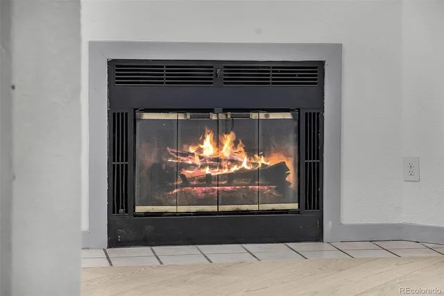a view of fireplace with wooden floor