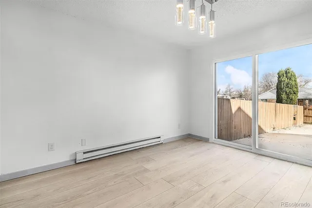 an empty room with windows and yard