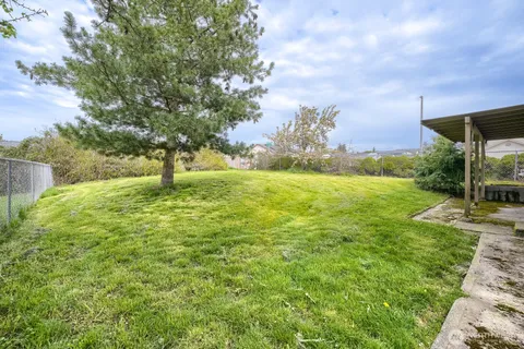 a backyard of a house with lots of green space