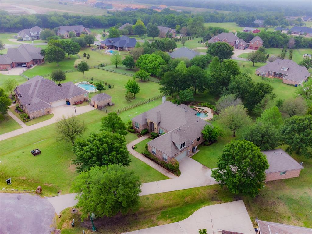 an aerial view of a house with a garden