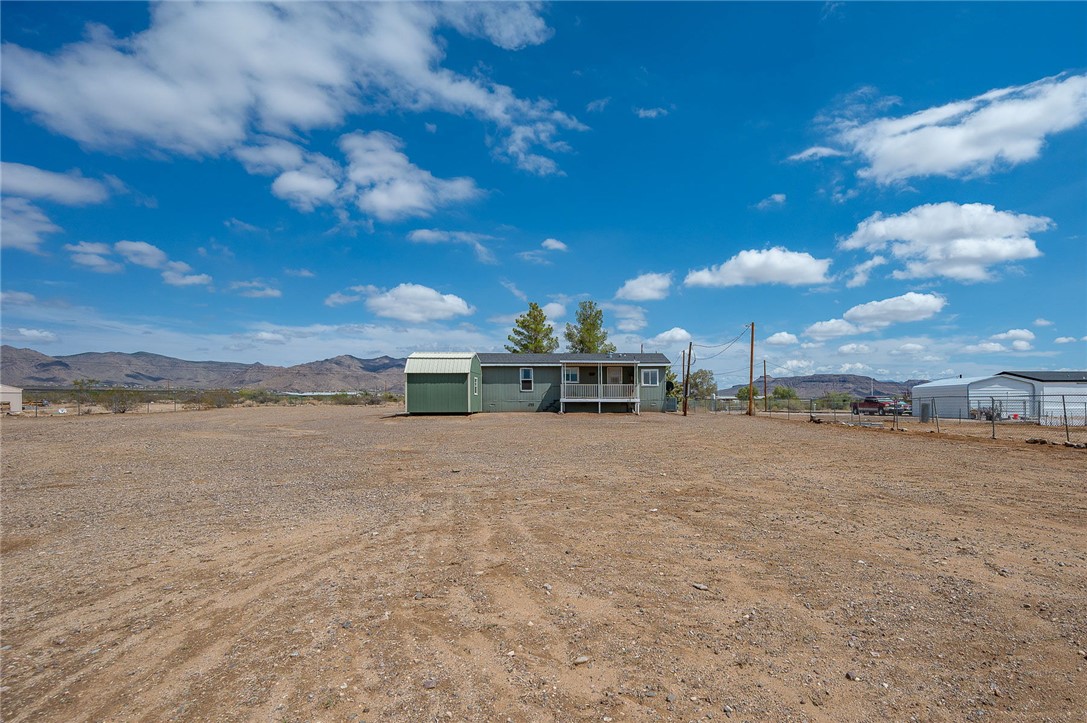 3583 North Avra Road Golden Valley, AZ 86413 - Photo 54 of 60 a view of a house with a yard