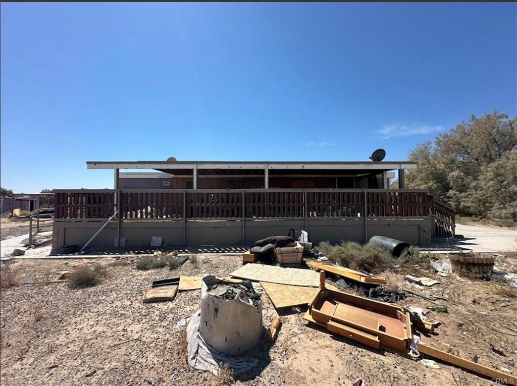 30453 Berry Road Newberry Springs, CA 92365 - Photo 2 of 9 a backyard of a house with table and chairs