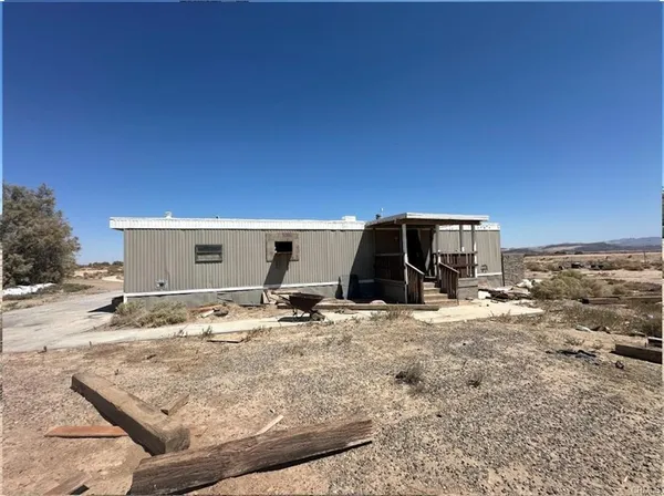 a view of a backyard of the house