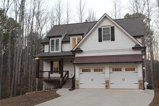 a front view of a house with a garage