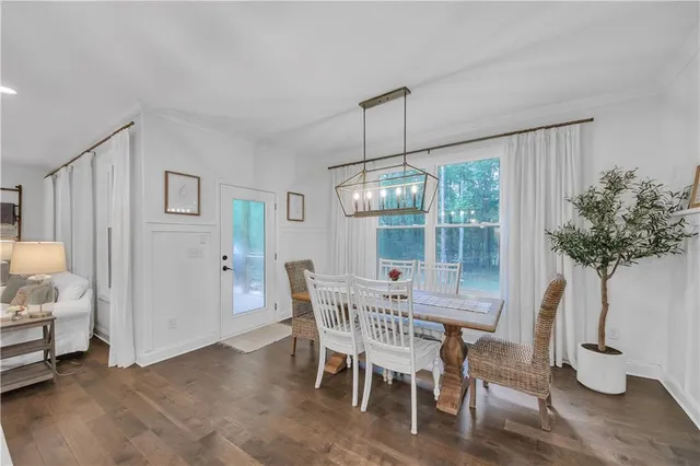 a open kitchen with stainless steel appliances granite countertop a sink a stove and a wooden floors