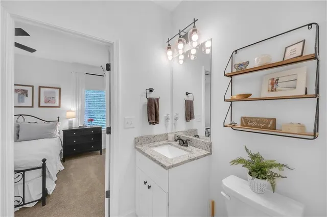 a utility room with dryer washer and shoe rack