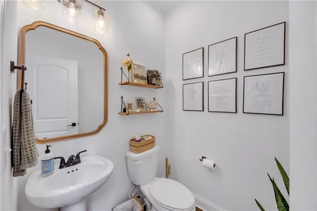 a view of a livingroom with furniture and a window