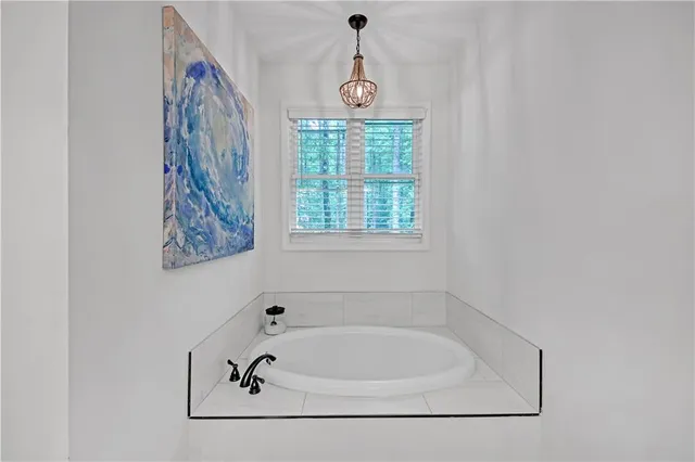 a bathroom with a double vanity sink mirror and shower