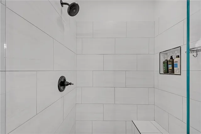 a view of walk in closet with clothes