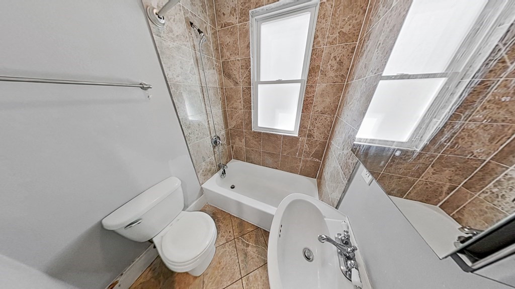 737 Parker Street, Unit 2 Boston, MA 02120 - Photo 12 of 12 a bathroom with a sink toilet and bath tub
