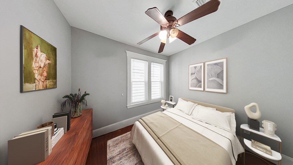 737 Parker Street, Unit 2 Boston, MA 02120 - Photo 3 of 12 a bedroom with a large bed and a window