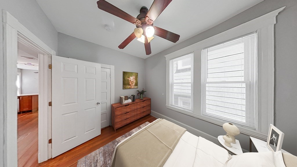 737 Parker Street, Unit 2 Boston, MA 02120 - Photo 4 of 12 a bed room with a bed and a window