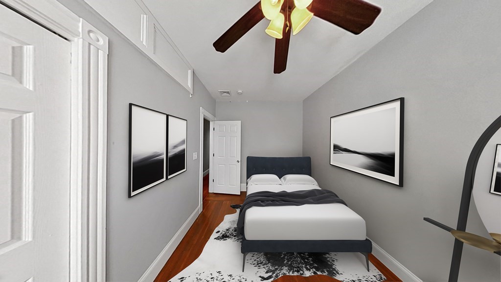 737 Parker Street, Unit 2 Boston, MA 02120 - Photo 6 of 12 a bedroom with a bed and wooden floor