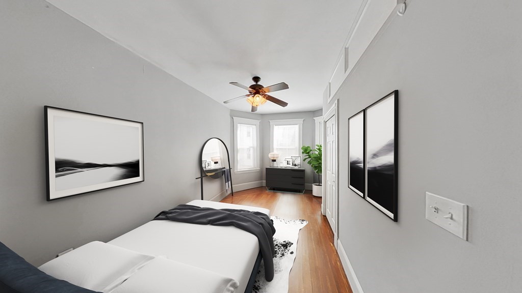 737 Parker Street, Unit 2 Boston, MA 02120 - Photo 7 of 12 a bedroom with a bed and a large mirror on the dresser