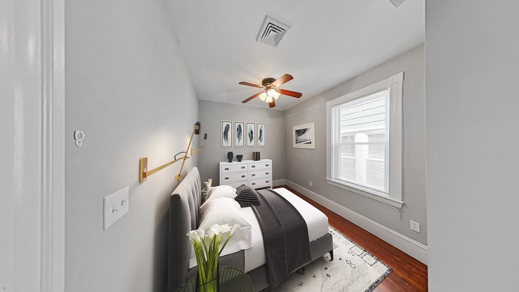 737 Parker Street, Unit 2 Boston, MA 02120 - Photo 8 of 12 a bedroom with a bed and a window