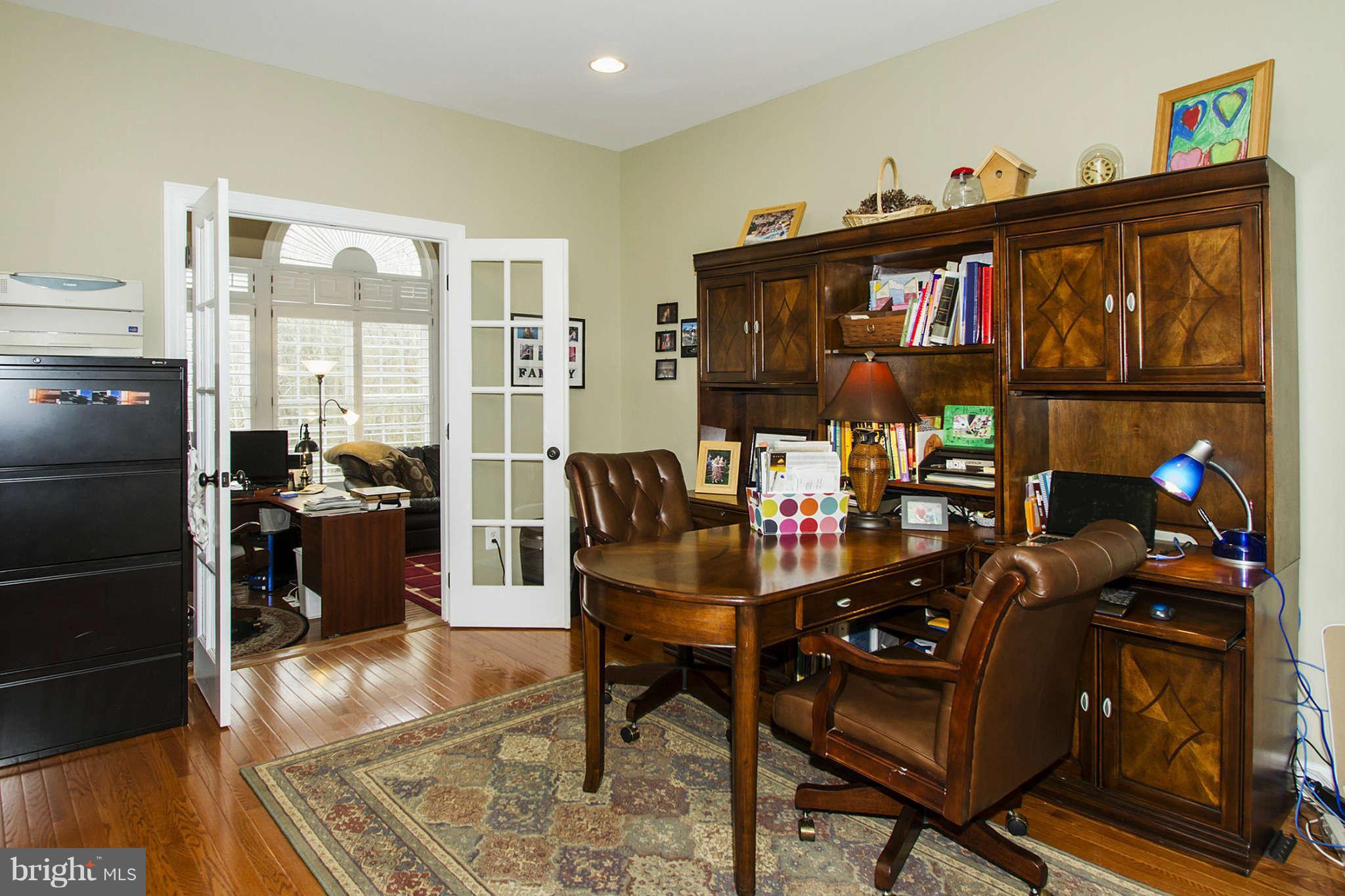 18301 Crestmount Road Boyds, MD 20841 - Photo 14 of 30 a living room with furniture a rug and a window