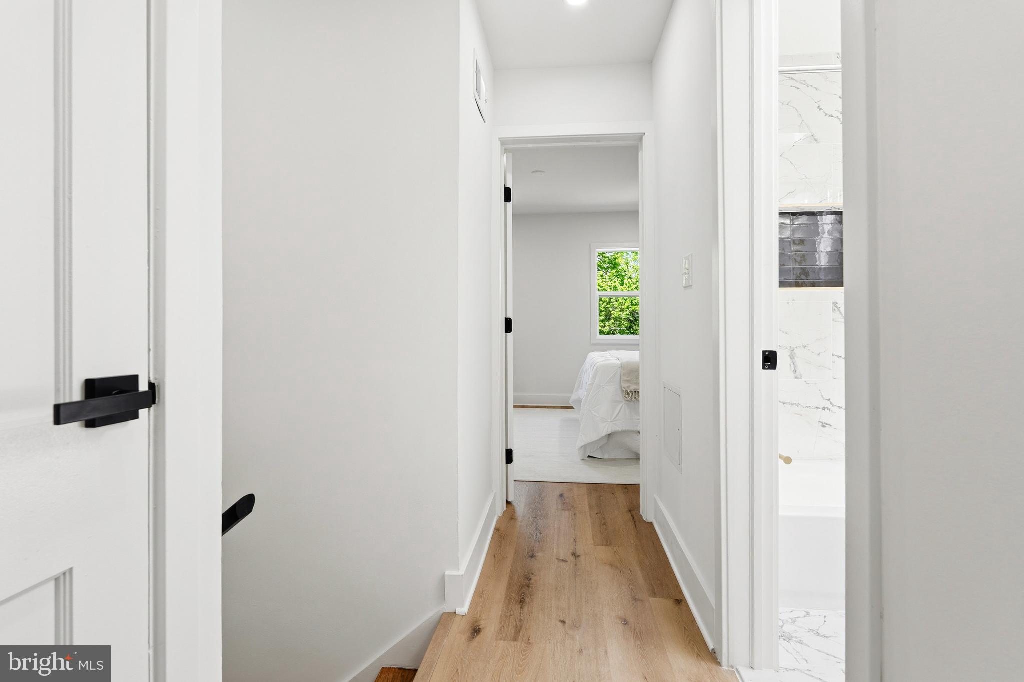 1357 Downing Street Northeast Washington, DC 20018 - Photo 31 of 57 a view of a bathroom from a hallway