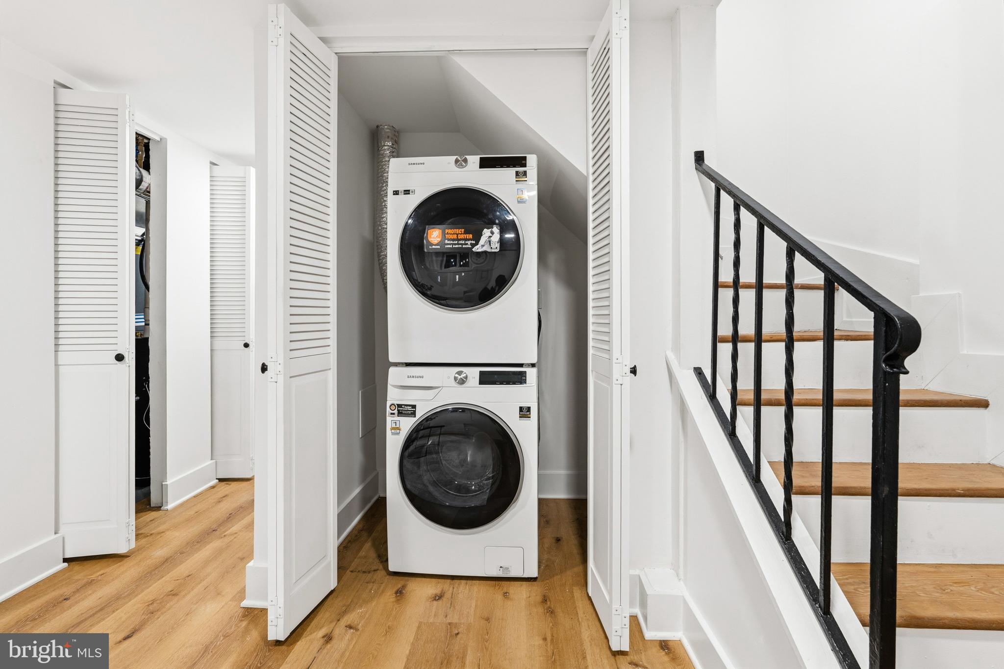 1357 Downing Street Northeast Washington, DC 20018 - Photo 47 of 57 a view of a hallway with washer and dryer