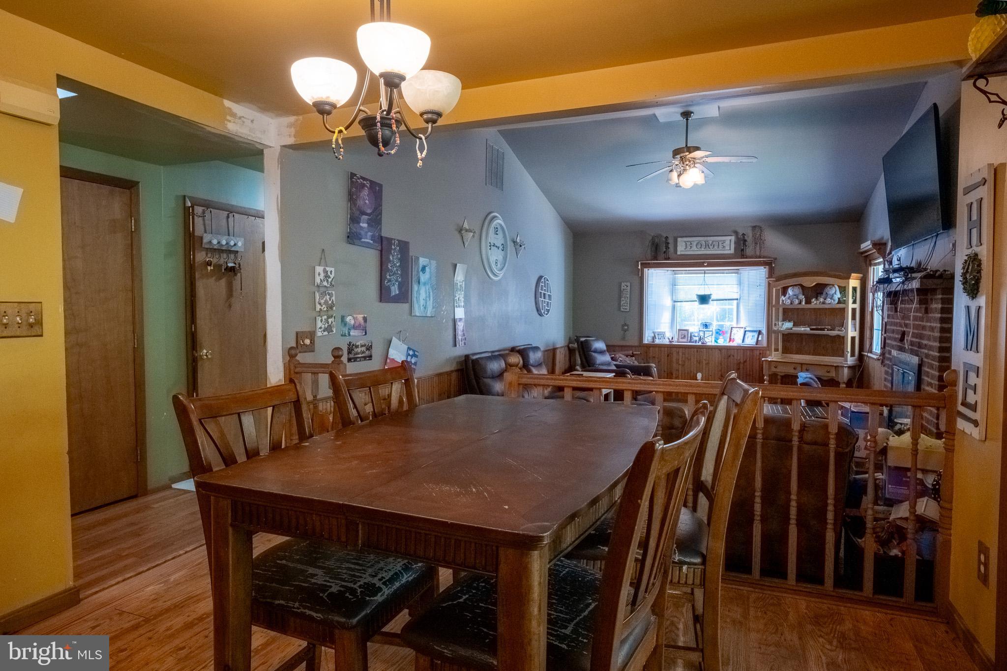 3931 Trego Mountain Road Keedysville, MD 21756 - Photo 11 of 26 a view of a dining room with furniture and wooden floor