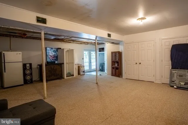 a bed room with a bed and a baby crib