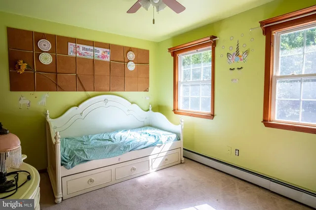 a bathroom with a toilet a sink and a mirror