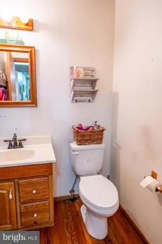 a living room with furniture and a ceiling fan