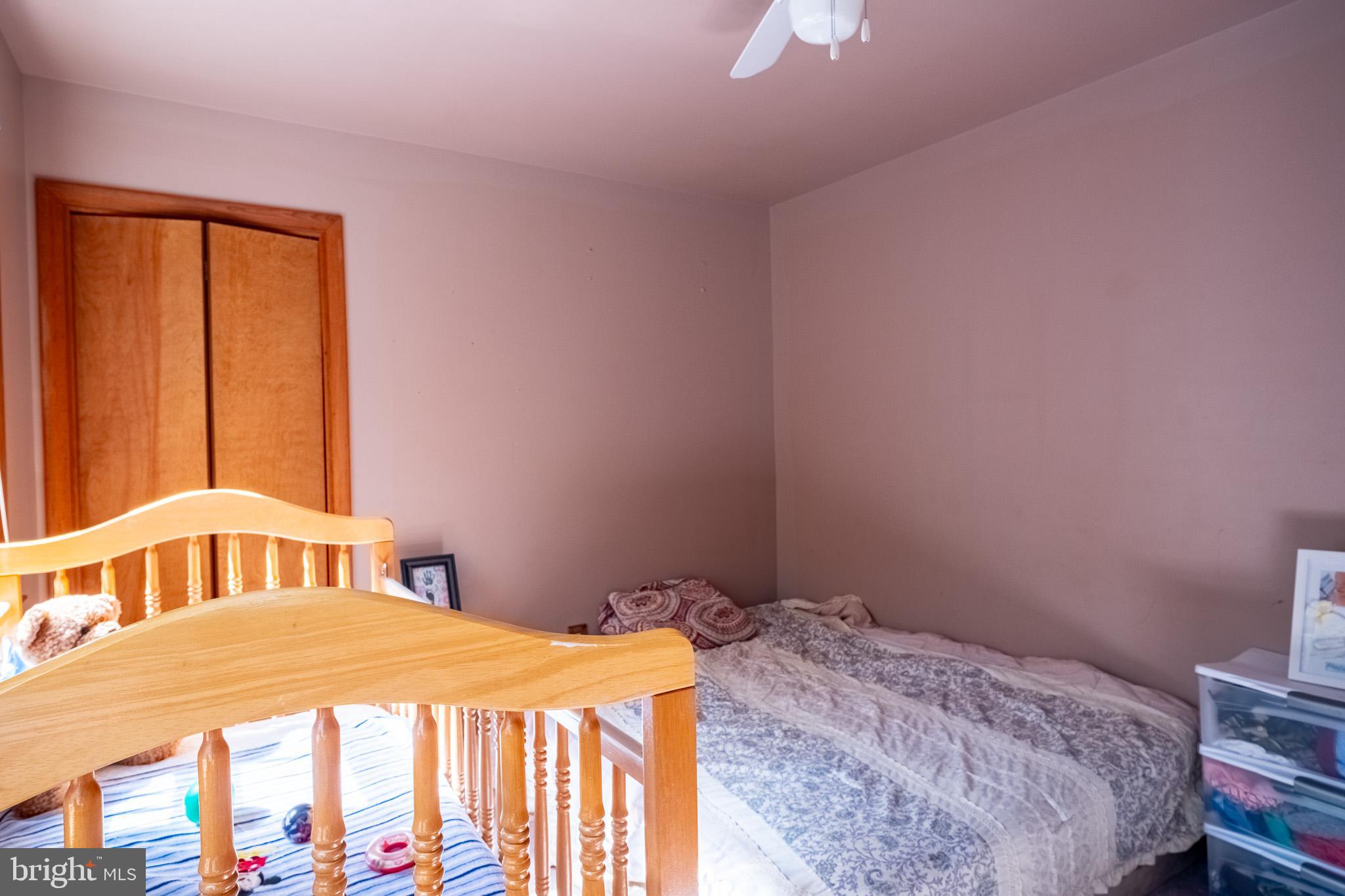 3931 Trego Mountain Road Keedysville, MD 21756 - Photo 20 of 26 a bedroom with a bed and a window
