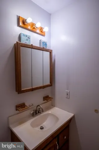 a bedroom with a bed and a table in it