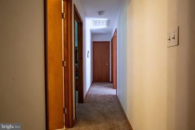 a bedroom with a bed and a television