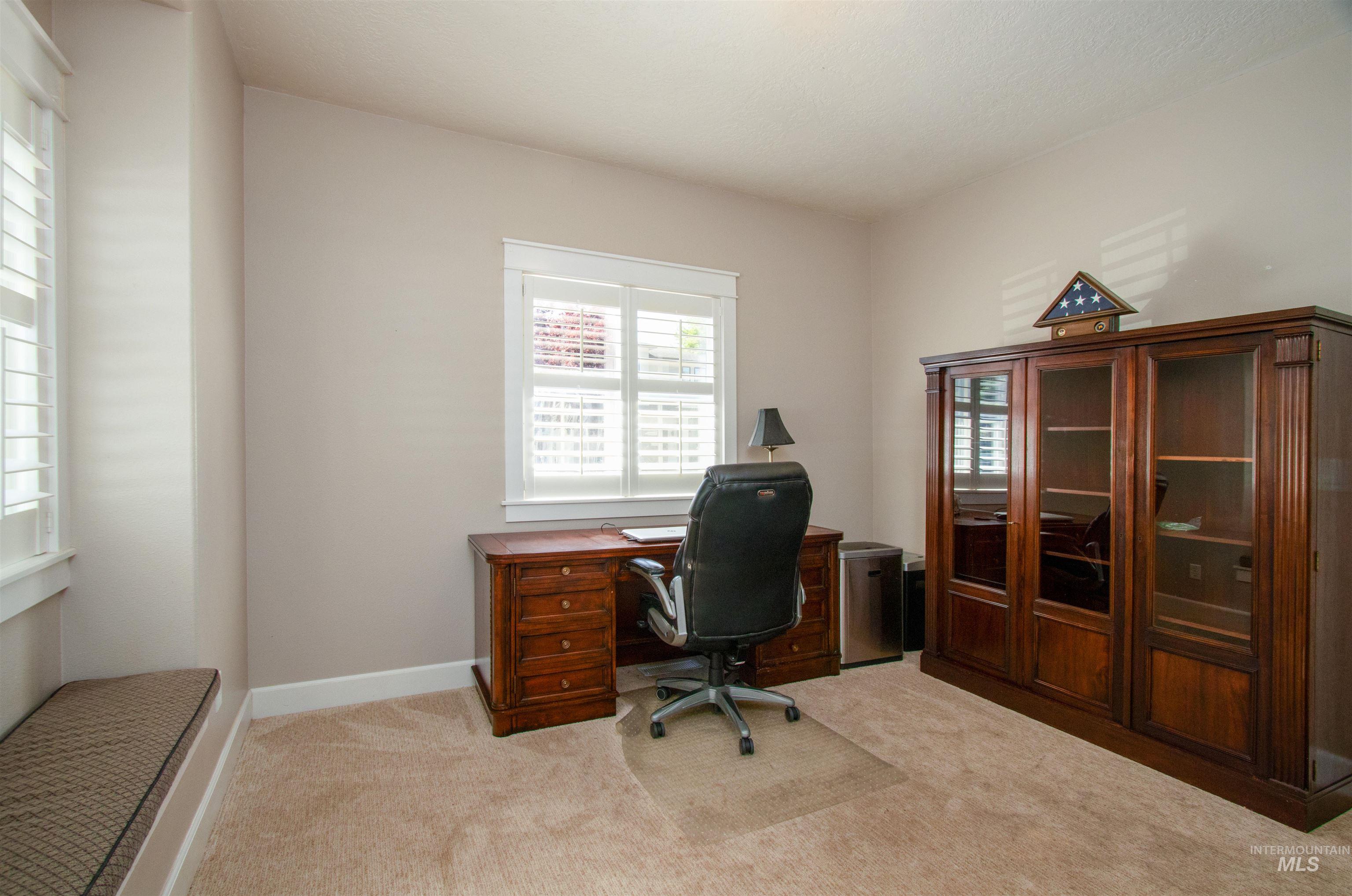 892 South Capitola Way Boise, ID 83712 - Photo 8 of 34 Neutral tone wall paint, light beige carpeting, and white baseboards