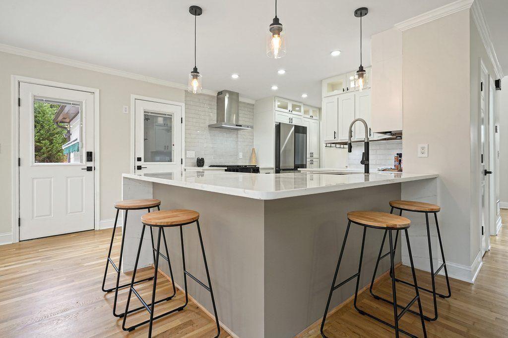 4110 Providence Square Alpharetta, GA 30009 - Photo 13 of 73 a dining hall with stainless steel appliances kitchen island granite countertop wooden floor and a view of kitchen