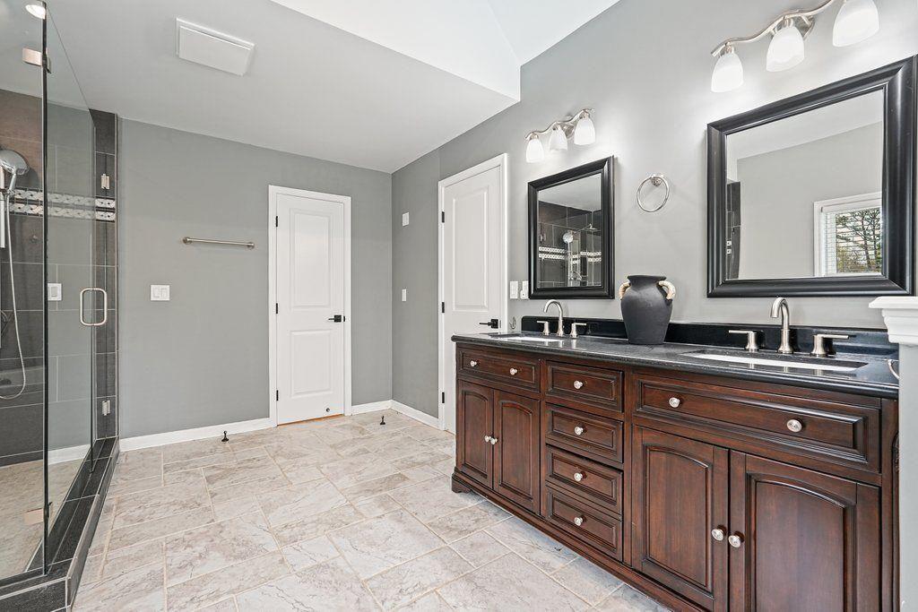 4110 Providence Square Alpharetta, GA 30009 - Photo 29 of 73 a spacious bathroom with a granite countertop double vanity sink and a mirror