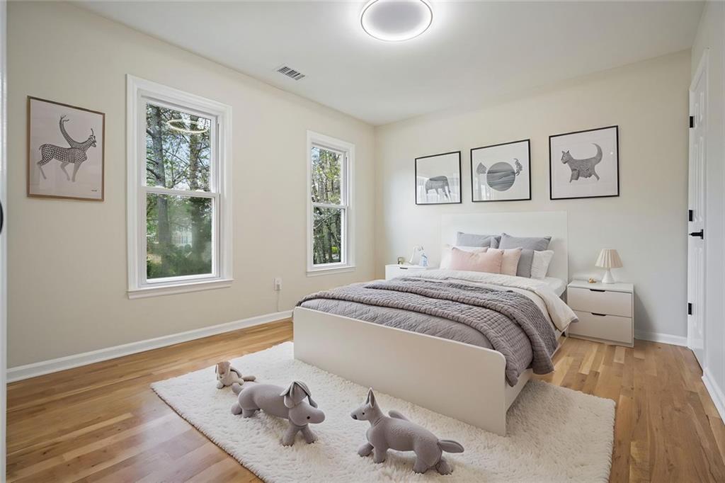 4110 Providence Square Alpharetta, GA 30009 - Photo 37 of 73 a bedroom with a bed and wooden floor